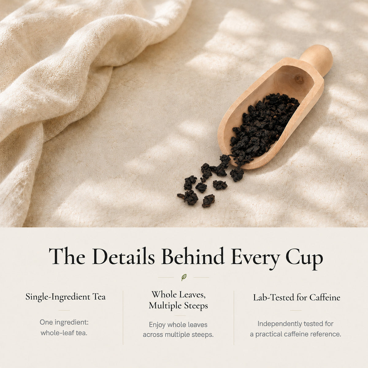 Noir Oolong Tea dark rolled whole leaves in a wooden scoop: single-ingredient tea, good for multiple steeps, lab-tested for caffeine