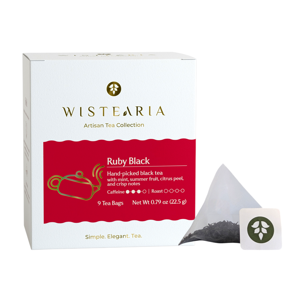 Wistearia Ruby Black Tea sachets box beside a pyramid tea sachet and brand tag